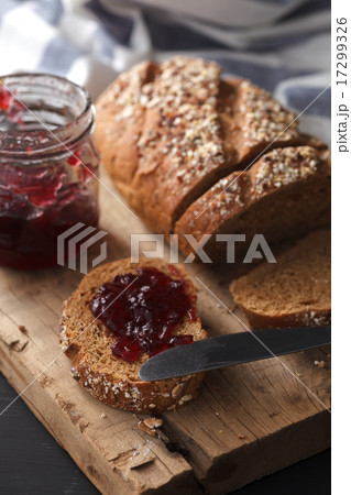 Dark multigrain bread whole grain jam fresh baked  17299326