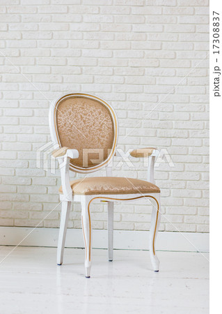 Luxury Golden Vintage Chair On Brick Wall Luxury Golden Vintage Chair On Brick Wall 17308837