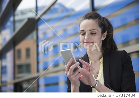 Happy Businesswoman using her smart phone. Happy Businesswoman using her smart phone. 17317434