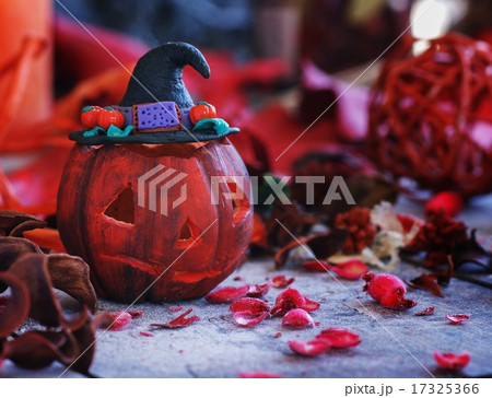 pumpkin on a background of dry plants and candles 17325366