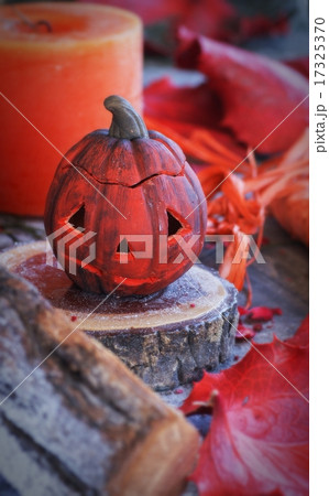 pumpkin on a background of dry plants and candles 17325370