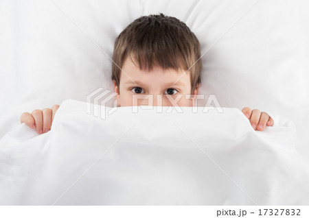 cheerful boy in white bed cheerful boy in white bed 17327832