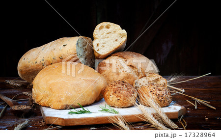 fresh bread and wheat on the wooden table fresh bread and wheat on the wooden table 17328964
