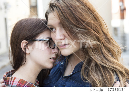 Woman comforting a sad caucasian girl  17336134