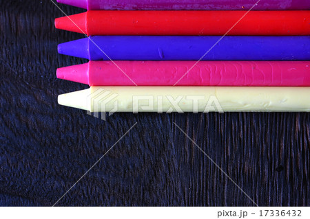 Oil pastel crayons on a wooden black table Oil pastel crayons on a wooden black table 17336432