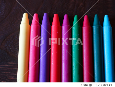 Oil pastel crayons on a wooden  black table 17336434