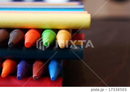 Oil pastel crayons on a wooden  black table 17336503