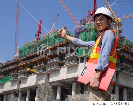 Construction worker holding a red file Construction worker holding a red file 17338465