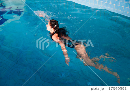 Attractive girl in swimming pool Attractive girl in swimming pool 17340591