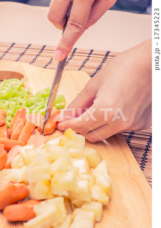 Preparing sausage and vegetables woman hands Preparing sausage and vegetables woman hands 17345223