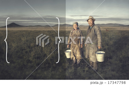 Mongolian Couple Farmers Holding Basin And Posing In The Field 17347798