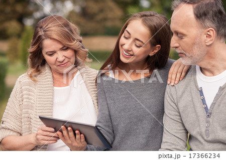 Cute mature family are watching a laptop Cute mature family are watching a laptop 17366234