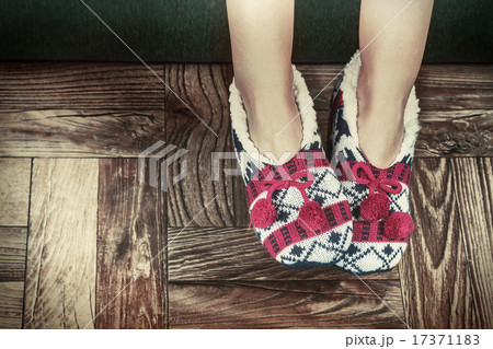 Christmas female legs in slippers 17371183
