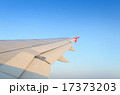 Sun shines on airplane wing on the morning 17373203
