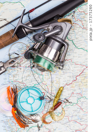 fishing tackles - rod, reel, line and lure on map fishing tackles - rod, reel, line and lure on map 17375260