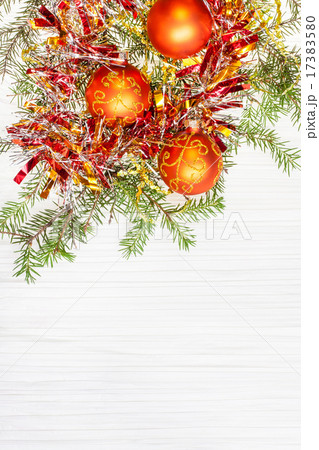 three orange Xmas baubles and twig on blank paper three orange Xmas baubles and twig on blank paper 17383580