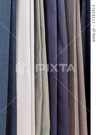 row of various woolen pants in tailoring atelier 17383913