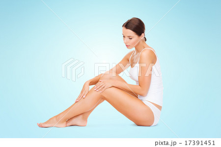beautiful woman in cotton underwear touching legs beautiful woman in cotton underwear touching legs 17391451