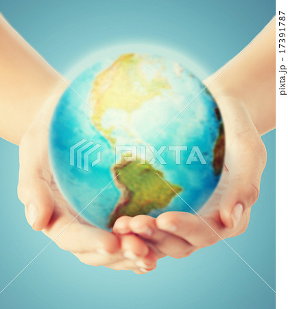close up of human hands with earth globe close up of human hands with earth globe 17391787