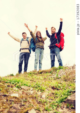 group of smiling friends with backpacks hiking group of smiling friends with backpacks hiking 17392083