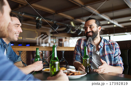 happy male friends drinking beer at bar or pub 17392819