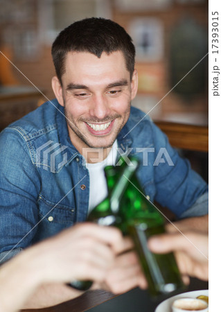 happy male friends drinking beer at bar or pub 17393015