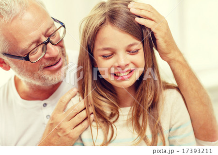 grandfather with crying granddaughter at home grandfather with crying granddaughter at home 17393211