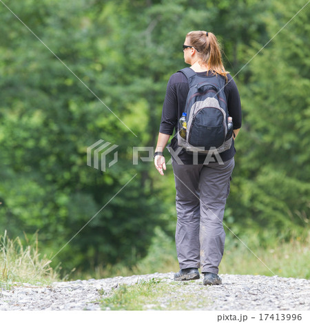 Hiker, young woman with backpack 17413996