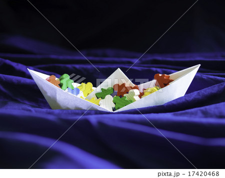 Immigration emigration migration concept, paperboat with meeples Immigration emigration migration concept, paperboat with meeples 17420468