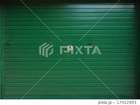 Closed green metal garage gate, texture 17422903