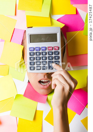 Businesswoman with lots of reminder notes Businesswoman with lots of reminder notes 17425487