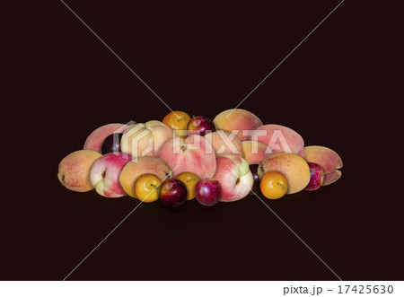 Stone fruit peaches, plums and apricots on  black 17425630