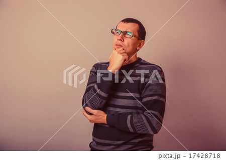 European-looking man of 30 years in glasses, thinking retro European-looking man of 30 years in glasses, thinking retro 17428718