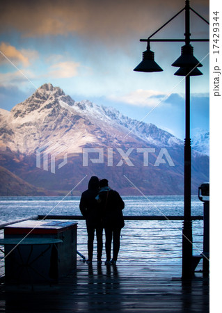 silhouette of couples at wakatipu lake view point silhouette of couples at wakatipu lake view point 17429344