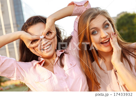 Two cheerful girls fooling around Two cheerful girls fooling around 17433932