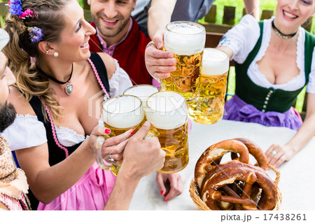 Clinking glasses with beer in Bavarian pub 17438261