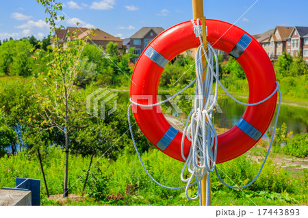 Lifebuoy on a background of luxury houses Lifebuoy on a background of luxury houses 17443893