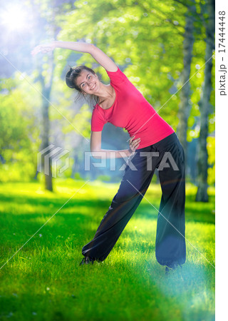 Stretching woman in outdoor sport exercise. Stretching woman in outdoor sport exercise. 17444448