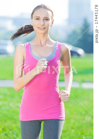 Jogging woman running in city park Jogging woman running in city park 17445178