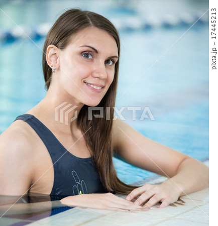 Portrait of a young woman in sport swimming pool 17445213