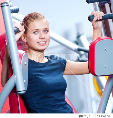 Woman at the gym exercising 17445878