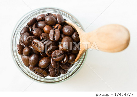 Coffee beans and an old wooden scoop Coffee beans and an old wooden scoop 17454777