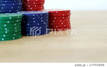 Stack of colorful poker chips on a table 17454999