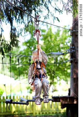 little boy ziplining 17459688