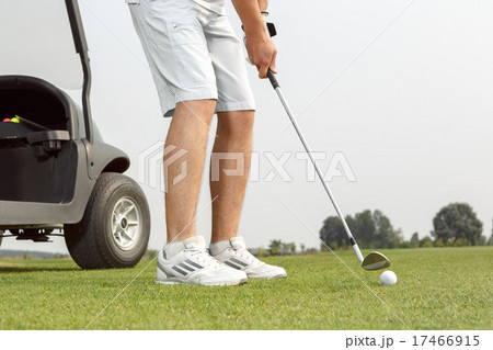 Young golfer getting ready to hit the ball Young golfer getting ready to hit the ball 17466915