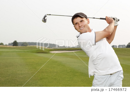 Golfer swinging his niblick out on the course Golfer swinging his niblick out on the course 17466972
