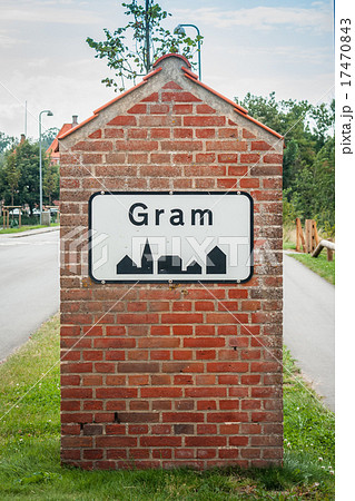 Gram city sign on a brick post Gram city sign on a brick post 17470843