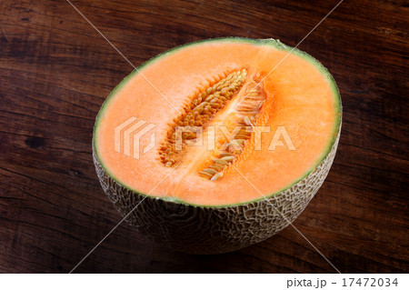 Organic cantaloupe on wooden table 17472034