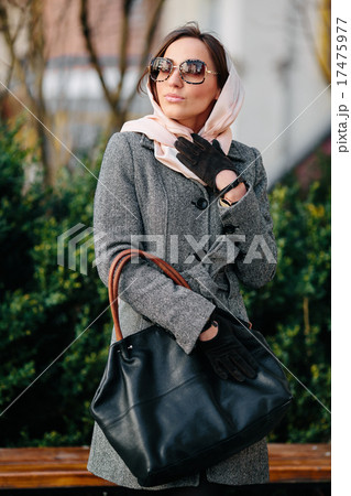 Happy young beautiful girl posing in the park 17475977