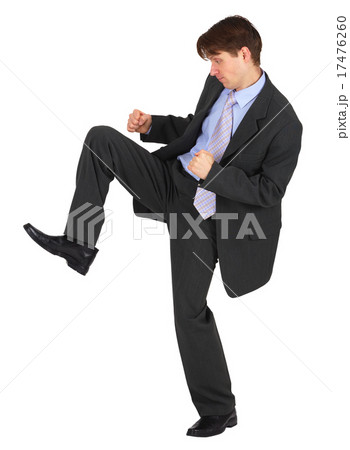 Businessman kicks down on white background Businessman kicks down on white background 17476260